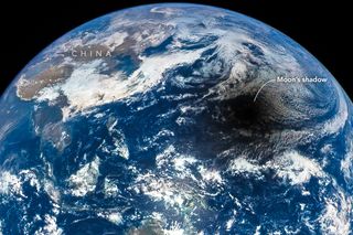 The shadow of the moon falls on the surface of the Earth during a total solar eclipse in 2016. This image was captured by the NASA-NOAA Deep Space Climate Observatory (DSCOVR) spacecraft.