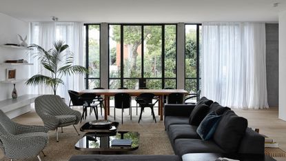 a dining room with a view through to an entryway