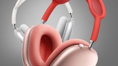 Two pairs of Apple AirPods Max headphones on a grey background