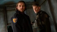 From left to right: Bode wearing a Cal Fire jacket and Boone wearing his sheriff's uniform. 