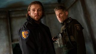 From left to right: Bode wearing a Cal Fire jacket and Boone wearing his sheriff's uniform. 