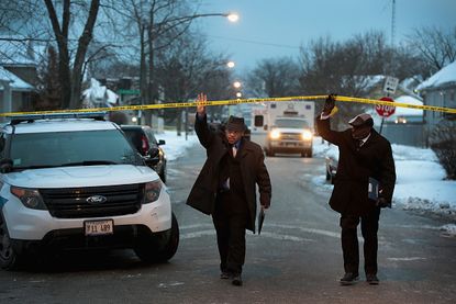 Police arrive at the scene of a quadruple homicide in Chicago earlier this month.