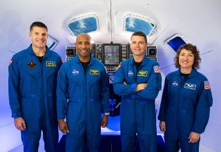The Artemis 2 crew, including Canadian Space Agency astronaut Jeremy Hansen (at left) and NASA astronauts Victor Glover, Reid Wiseman and Christina Koch, pose together in an Orion spacecraft simulator at Johnson Space Center.