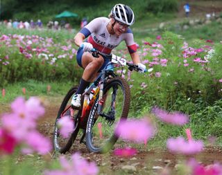 IZU JAPAN JULY 27 Evie Richards of Team Great Britain rides through flowery landscape during the Womens Crosscountry race on day four of the Tokyo 2020 Olympic Games at Izu Mountain Bike Course on July 27 2021 in Izu Shizuoka Japan Photo by Michael SteeleGetty Images