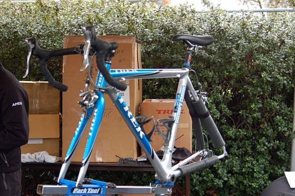 An old frame sits on the workstand.