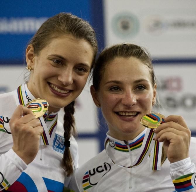 Germany's Miriam Welte (L) and Kristina Vogel pose after winning gold during the Women's Team Sprint