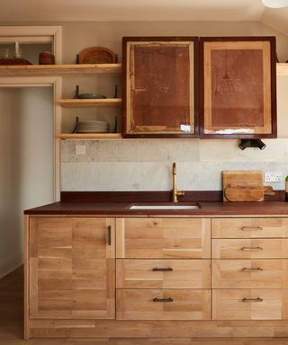Retrouvius kitchen made from salvaged parquet flooring and old wooden frames