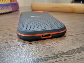 A black and orange SanDisk Extreme PRO Portable SSD