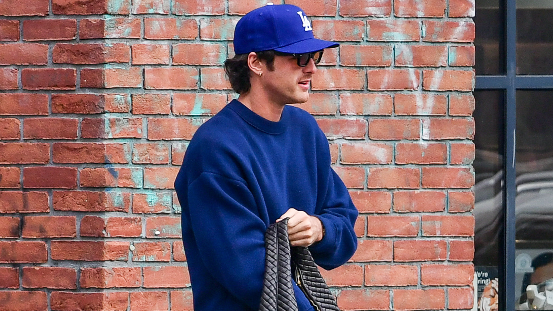 Jacob Elordi was spotted wearing bright red Nike x Jacquemus Moon sneakers and a Bottega Veneta bag