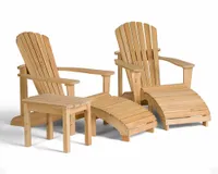 A pair of wooden Adirondack chairs with footstools and side table