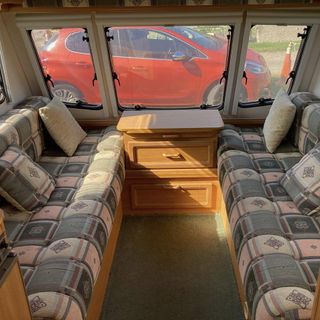 caravan interior with pink sofas