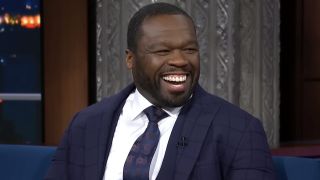 50 Cent laughs on The Late Show with Stephen Colbert.