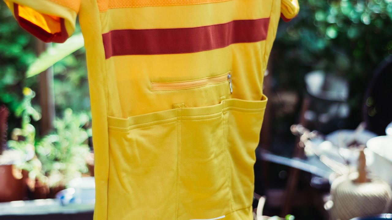 The rear pockets of a yellow jersey