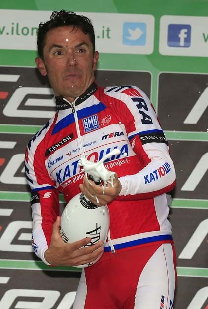 Joaquim Rodriguez sprays the champagne after taking his second title