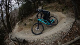Christian Textor riding his YT mountain bike downhill