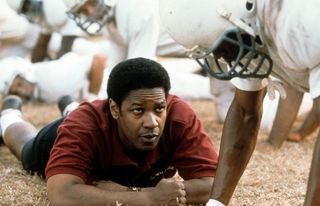 Denzel Washington motivates football players in a scene form the film 'Remember The Titans', 2000.