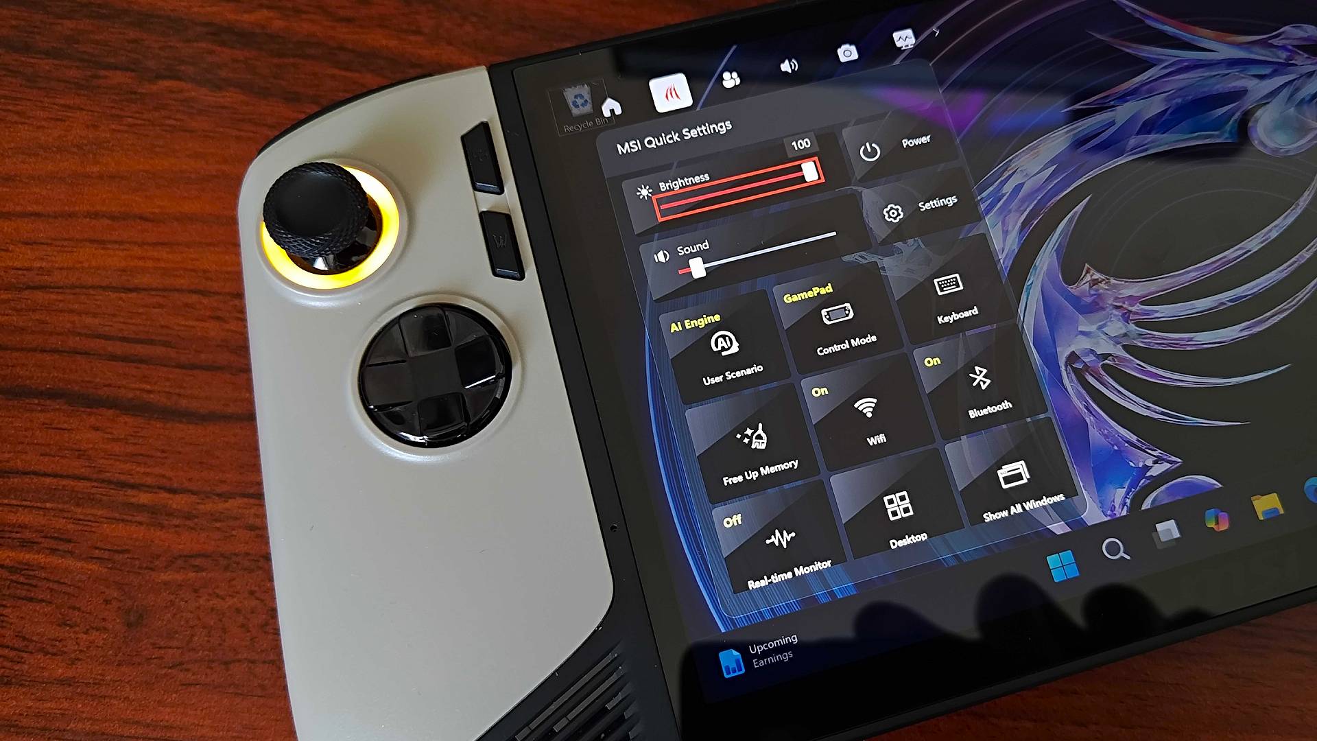 Close up of MSI Claw 8 AI+ handheld with quick menu on screen.