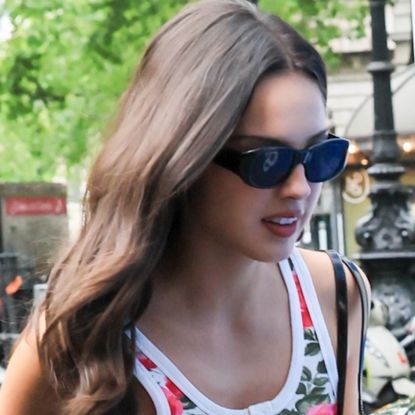 Olivia Rodrigo traded a white tank top for a floral alternative, black jeans, and pointy pumps