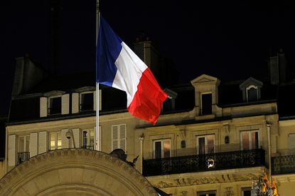 France's flag flies at half-mast outside Elysee Palace