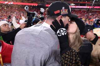 Taylor Swift kisses Travis Kelce after the Chiefs win their AFC championship