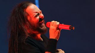 Jonathan Davis fronting Korn onstage in 2025