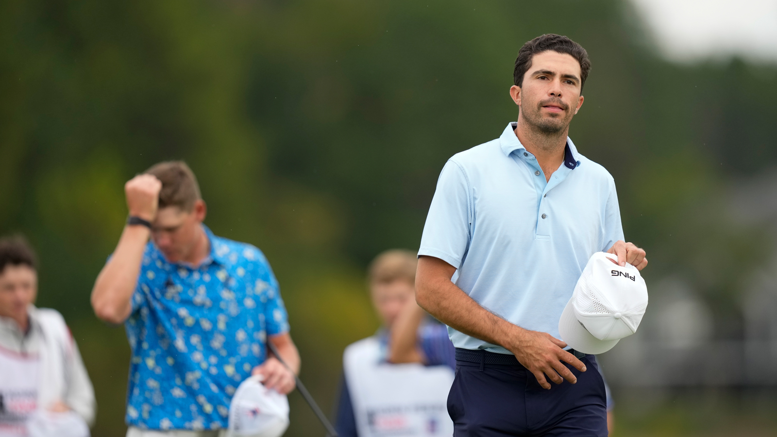 Alvaro Ortiz walks off the green