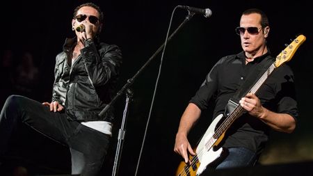 Chester Bennington of Linkin Park (L) and bassist Robert DeLeo of Stone Temple Pilots perform at Verizon Wireless Amphitheater on May 18, 2013 in Irvine, California