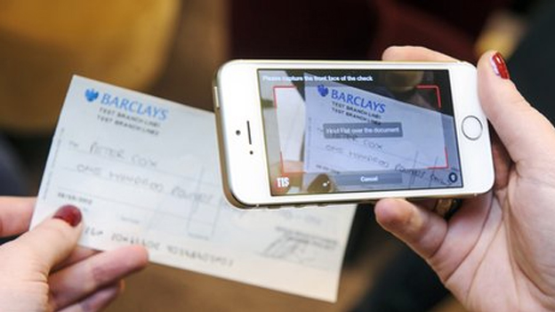 Say cheese! UK to trial depositing cheques via smartphone photos