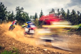 Motocross racers spraying dirt by VM