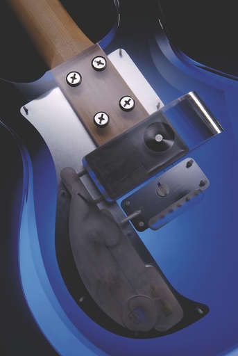 The extended neck is attached to the body by four chunky bolts