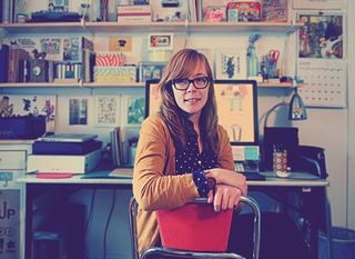 Lydia Nicholls at desk