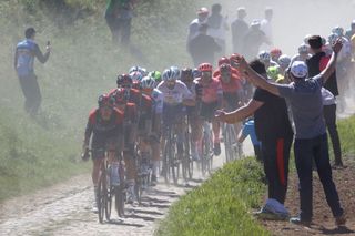 INEOS Grenadierss riders lead the pack on a cobblestone sector during the 119th edition of the ParisRoubaix oneday classic cycling race between Compiegne and Roubaix northern France on April 17 2022 Photo by Thomas SAMSON AFP Photo by THOMAS SAMSONAFP via Getty Images