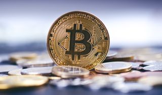 Golden bitcoin coins on a dark background
