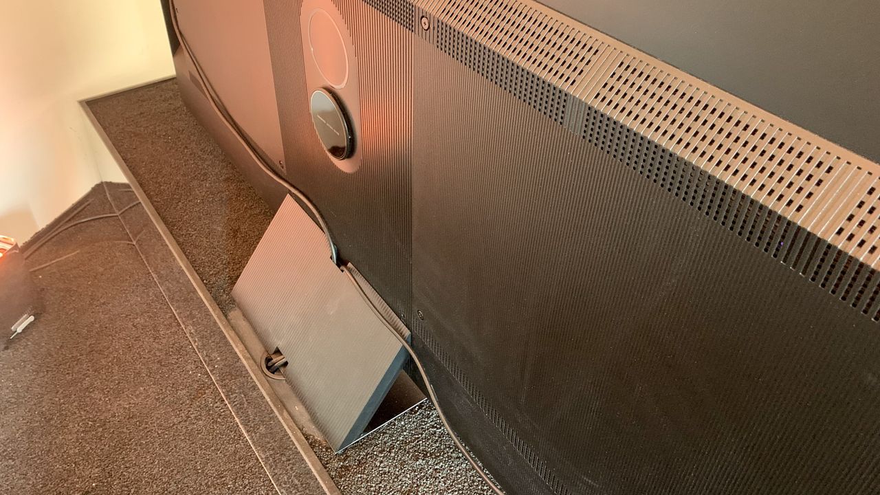 TCL C84 Mini LED TV shown from the back, to reveal the Onkyo subwoofer built into the back and base