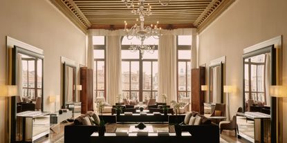 A Venetian palazzo is filled with modern furniture imbued with a lavish, glamorous feel.