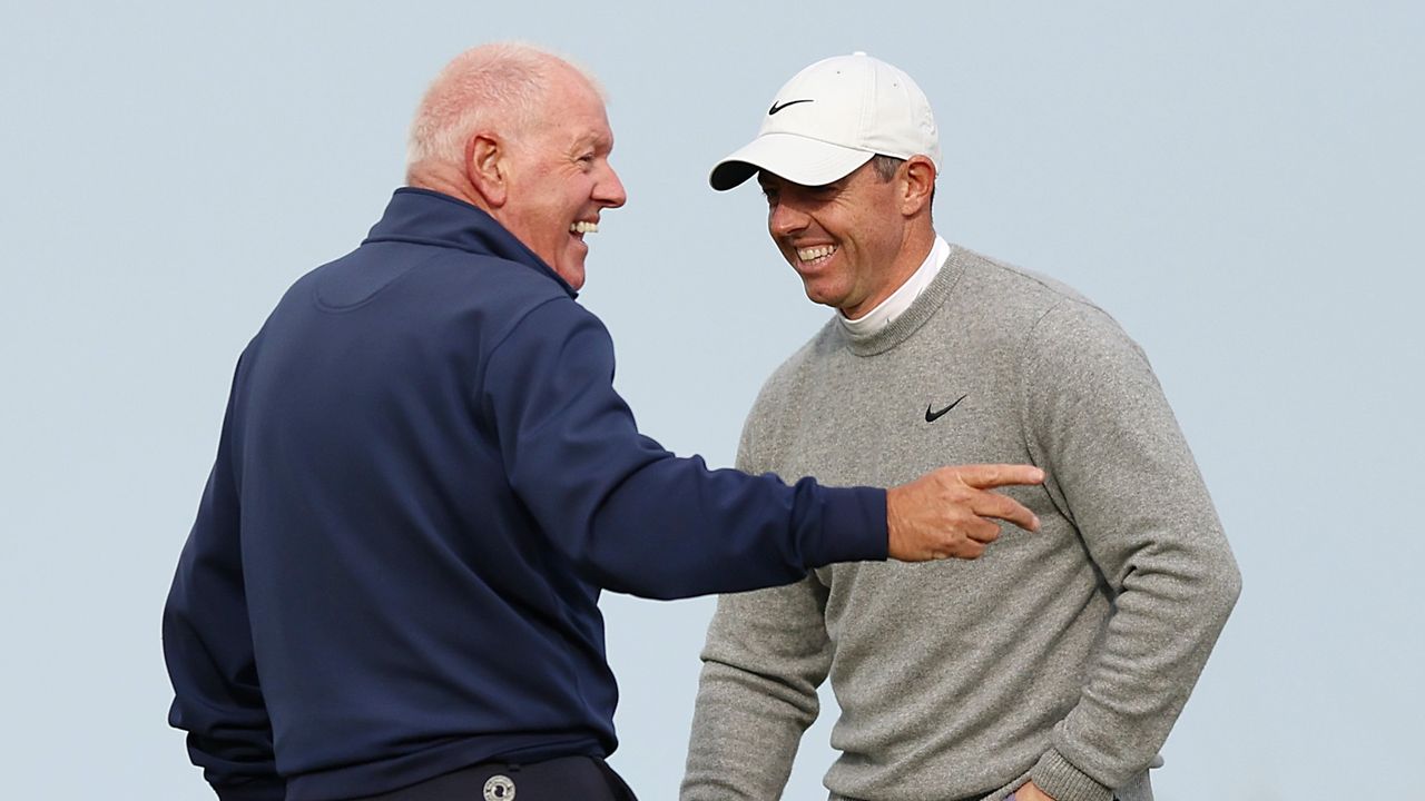 Rory McIlroy &amp; father Gerry McIlroy smiling while playing golf together