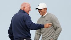 Rory McIlroy & father Gerry McIlroy smiling while playing golf together