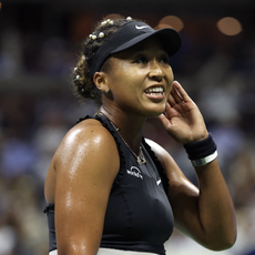 Naomi Osaka plays her second match at the 2024 us tennis open wearing pearls in her hair and bows on her outfit