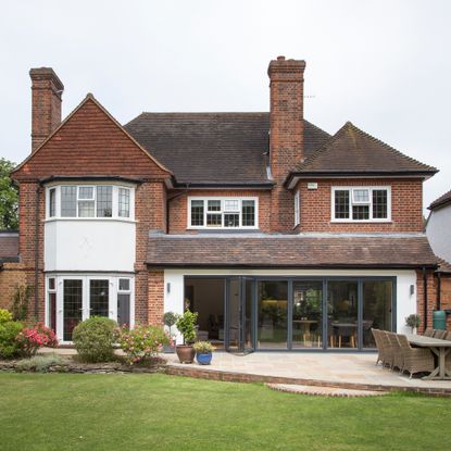 Exterior image of a large detached house with single storey extension