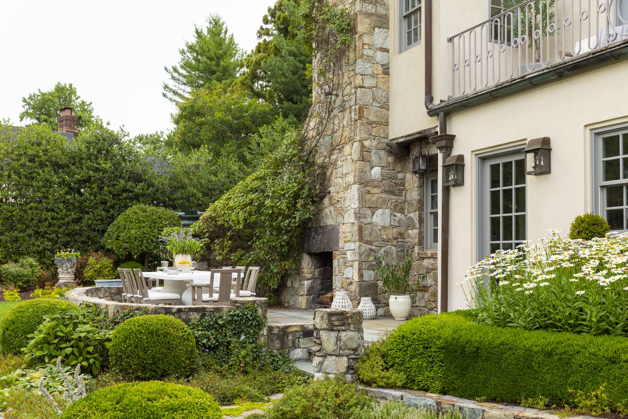 A lush backyard with round seating