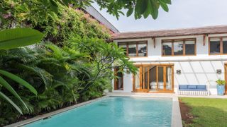 Swimming pool fitted in long garden