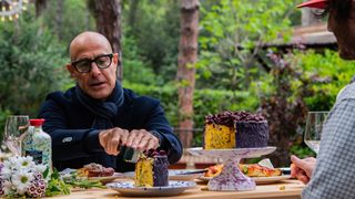 Stanley Tucci cutting into dessert in Puglia, Italy