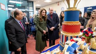 Prince William, Duke of Cambridge and Catherine, Duchess of Cambridge inspect cakes as they visit the Khidmat Centre on January 15, 2020 in Bradford, United Kingdom.