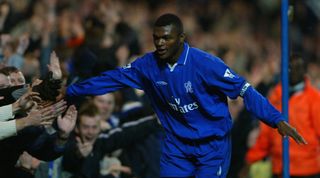 LONDON - NOVEMBER 30: Marcel Desailly of Chelsea celebrates scoring their second goal with the fans during the Barclaycard Premiership match between Chelsea and Sunderland at Stamford Bridge in London on November 30, 2002. (Photo By Ben Radford/Getty Images)