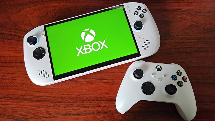 Lenovo Legion Go S with Xbox logo on screen next to white Series X controller on woodgrain surface 