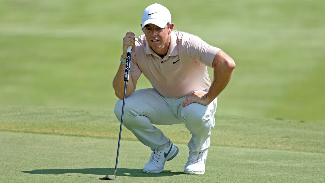 Rory McIlroy of Northern Ireland lines up a putt on the sixth green during the final round of the FedEx St. Jude Championship