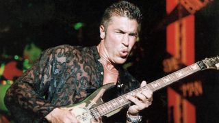 American guitarist and musician George Lynch, of the band Dokken, playing guitar during a concert, September 1997 