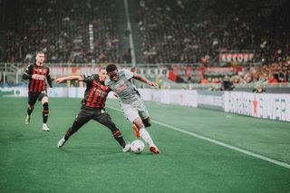 Lucas Gourna-Douath (R) of FC Salzburg fights for the ball with Ismael Bennacer of AC Milan during the UEFA Champions League group E match between AC Milan and FC Salzburg at Giuseppe Meazza Stadium on November 02, 2022 in Milan, Italy.