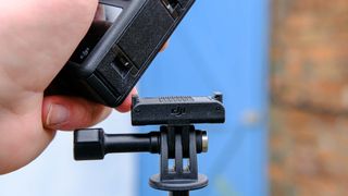 DJI Osmo Action 4 attached to tripod