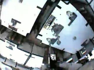 aut Chris Cassidy's helmet camera shows a new ammonia pump being installed during a May 11, 2013 spacewalk.